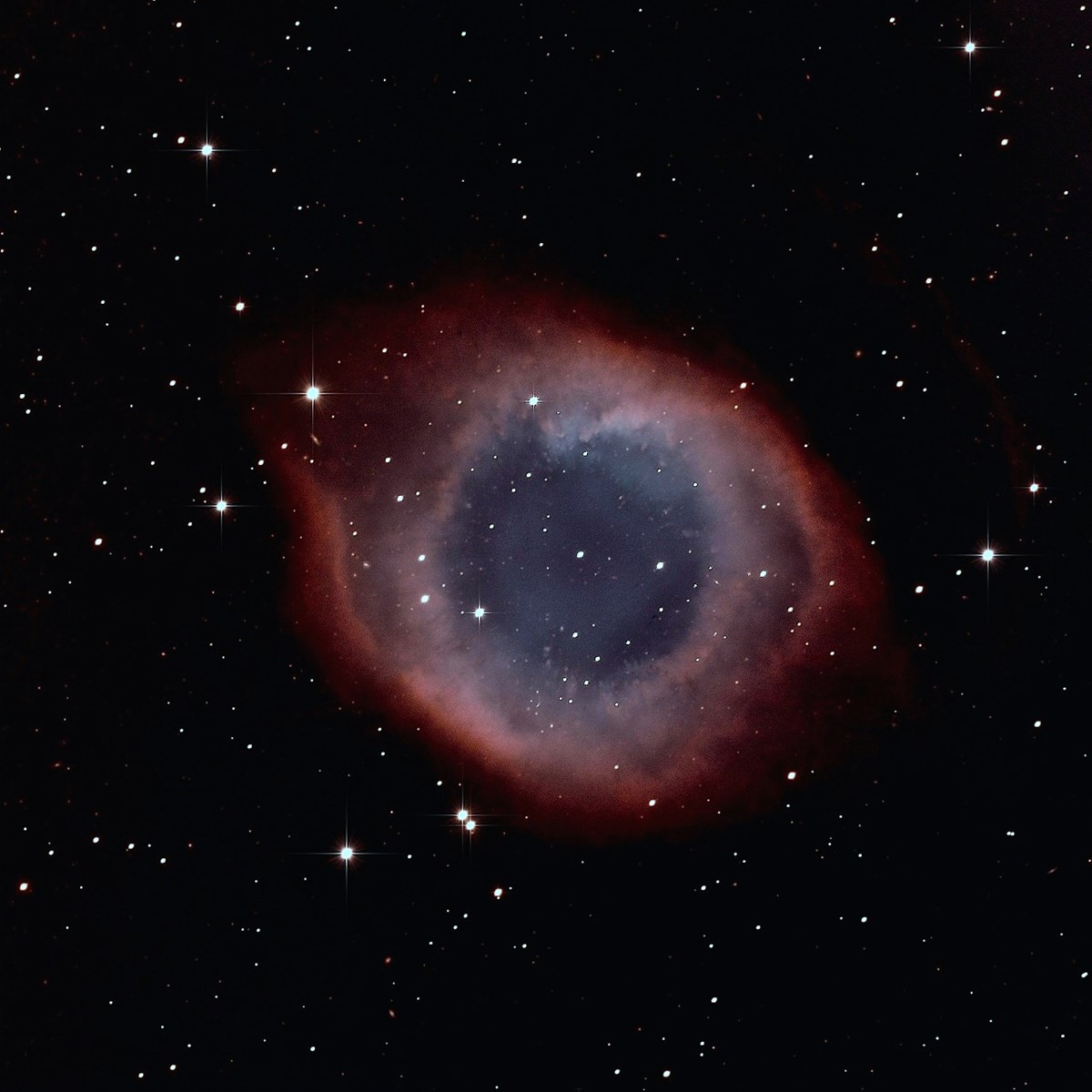 The Helix Nebula in the constellation Aquarius is an example of a planetary nebula, gas emitted from a star at the end of its burning cycle. It is 700 light years (400 trillion miles) from Earth and is a mere 2.5 light years wide.