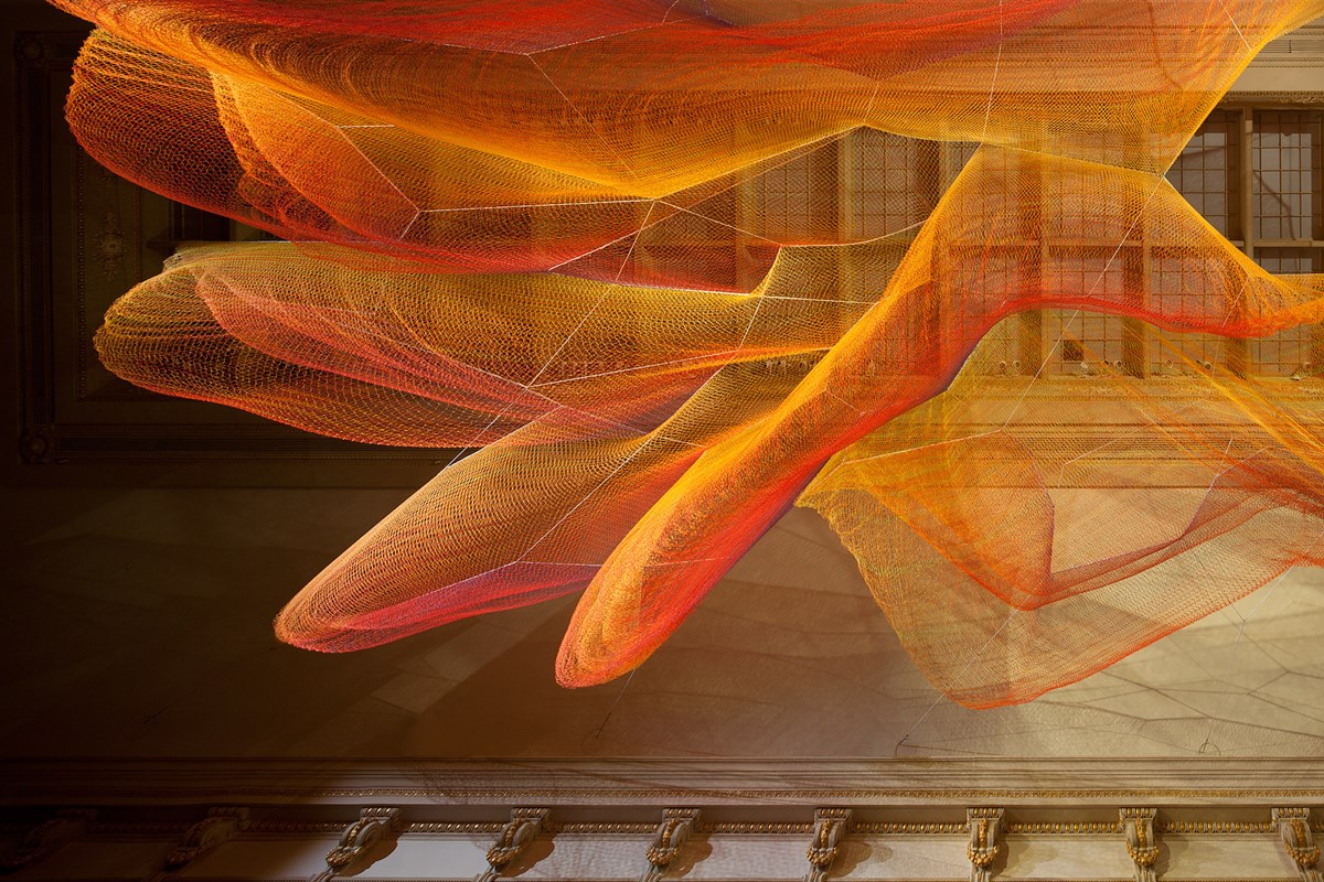 Janet Echelman’s “1.8” invites you to lie down to view a representation of the energy released by the 2011 Tohoku earthquake and tsunami. The carpet is partly made from old fishing nets. The installation’s name draws from the quake shortening the day by 1.8 millionths of a second as it shifted the earth on its axis. Janet Echelman’s “1.8” invites you to lie down to view a representation of the energy released by the 2011 Tohoku earthquake and tsunami. The carpet is partly made from old fishing nets. The installation’s name draws from the quake shortening the day by 1.8 millionths of a second as it shifted the earth on its axis.