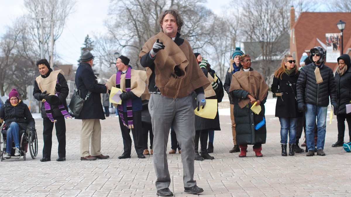 Wheaton alumnus Peter Heltzel leads protesters.