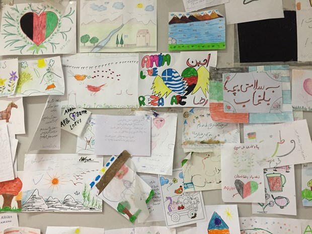 Drawings by refugee children cover a wall at Athen's Galatsi Park. Drawings by refugee children cover a wall at Athen's Galatsi Park.