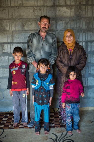 Hadi Ali with his wife and some of their seven children. Hadi Ali with his wife and some of their seven children.