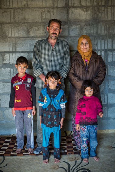 Hadi Ali with his wife and some of their seven children.