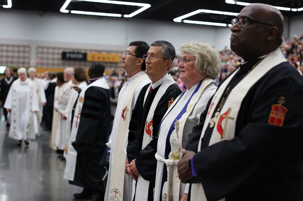 Bishops move to their places for opening worship. Photo by Kathleen Barry, United Methodist News Service