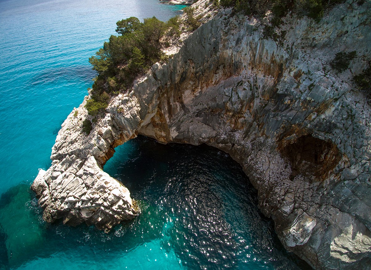 A Mediterranean natural arch in Sardinia. A Mediterranean natural arch in Sardinia.
