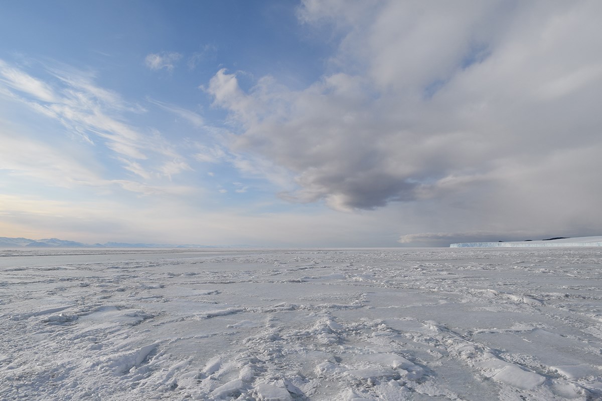 While standing on the sea ice at Cape Evans, Captain Robert Falcon Scott’s home prior to venturing to the South Pole, one can see the Transantarctic Mountain range (left) well over thirty miles away as well as an ice cliff formed by the glaciers of Ross Island (right).