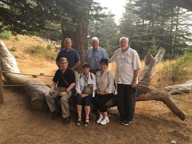 Reader John Eckeberger (far right) and his ministry team at the Forest of the Cedars of God in Lebanon with the September issue of CT.