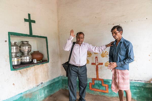 Pastor Bhagwana Lal spends his day praying with tribal families at their homes.