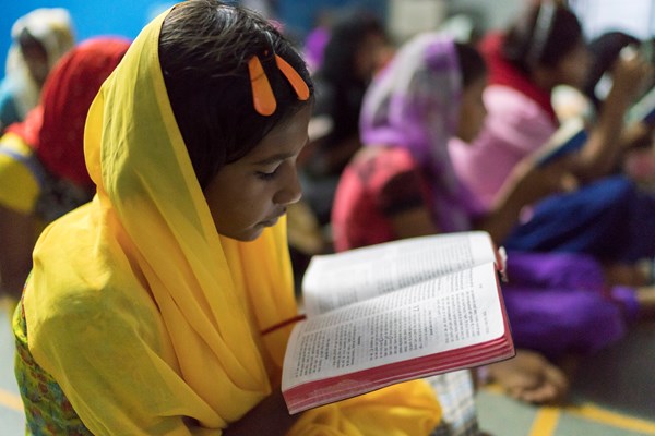 A student at a Christian school reads her Bible.
