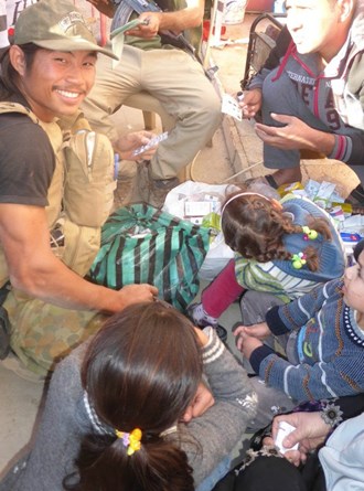 A Mosul family receives help from FBR medic Joseph, who is from Burma's Karen state.