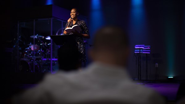 female pastor preaching