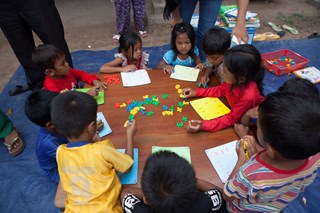 Rural children whose families cannot afford school fees learn and play the church, built in pastor Sin Prom’s front yard. 