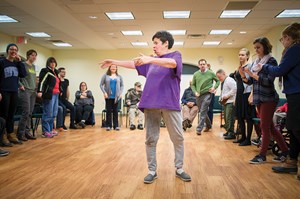 Francene Short leads the community in “flying” to Gershwin’s Rhapsody in Blue. 