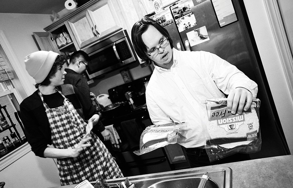 Nathan Freshwater (right), who has Down syndrome,  gathers weekly with his housemates at Friendship House for a meal, fellowship, and prayer. 