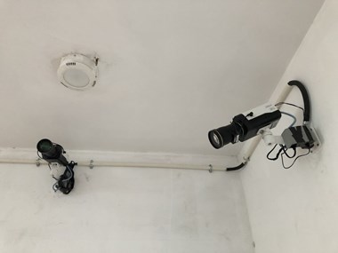 Security cameras with facial recognition technology, in the lobby of the Beijing building where Zion Church rents space.