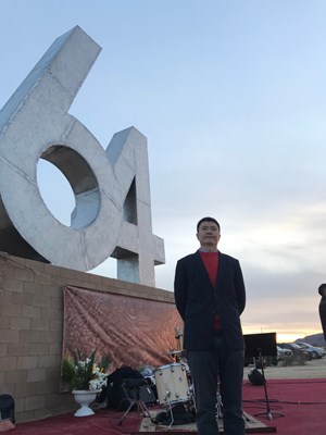 Zhou Fengsuo in front of the Tiananmen Monument erected this year in the US. “64” references the date of the massacre, June 4. 