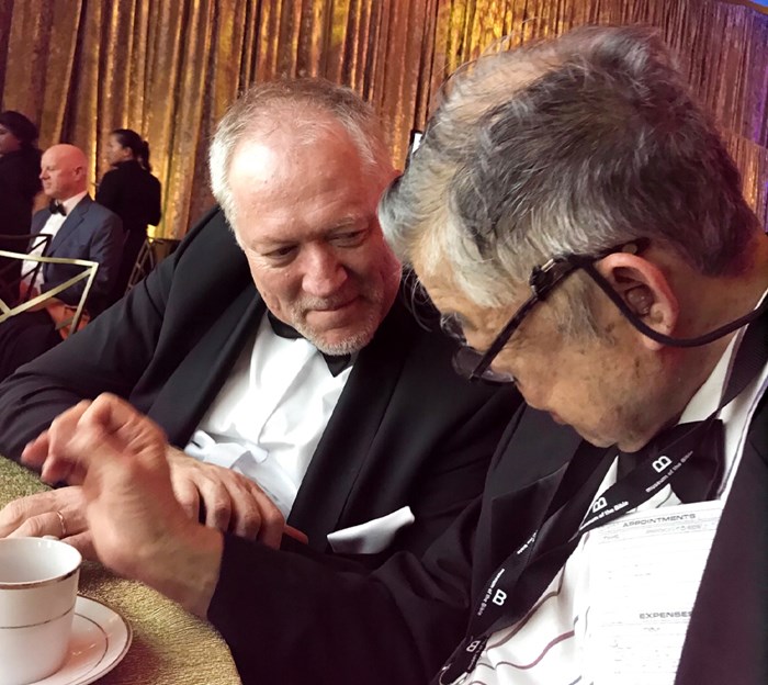 Edwin Yamauchi (right) asked David Trobisch (left) about the Mark fragment during the opening banquet at the Museum of the Bible.